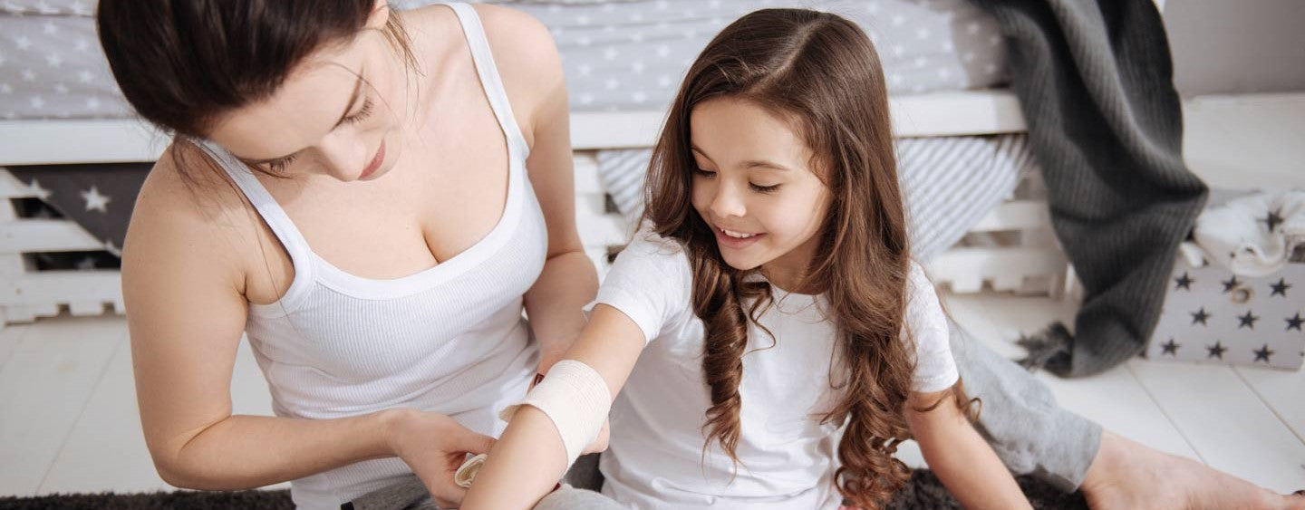 First Aid on girl with mother