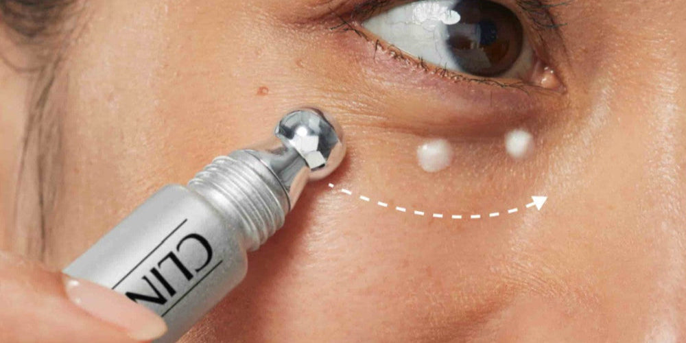 Woman applying clinique skincare under her eye