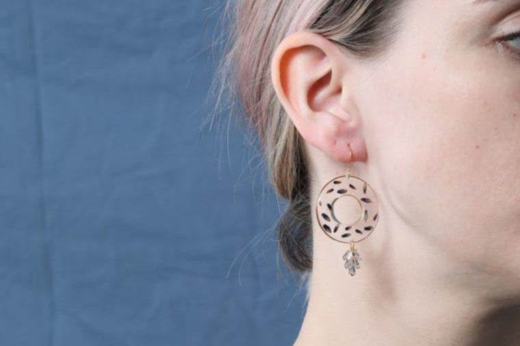 Nordic Flowers unique jewellery on ear of lady with blonde hair