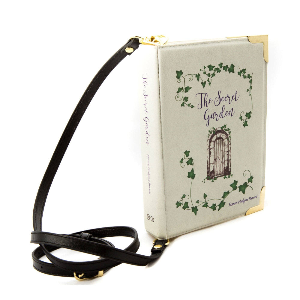 Book-shaped handbag with 'The Secret Garden' design on a white background