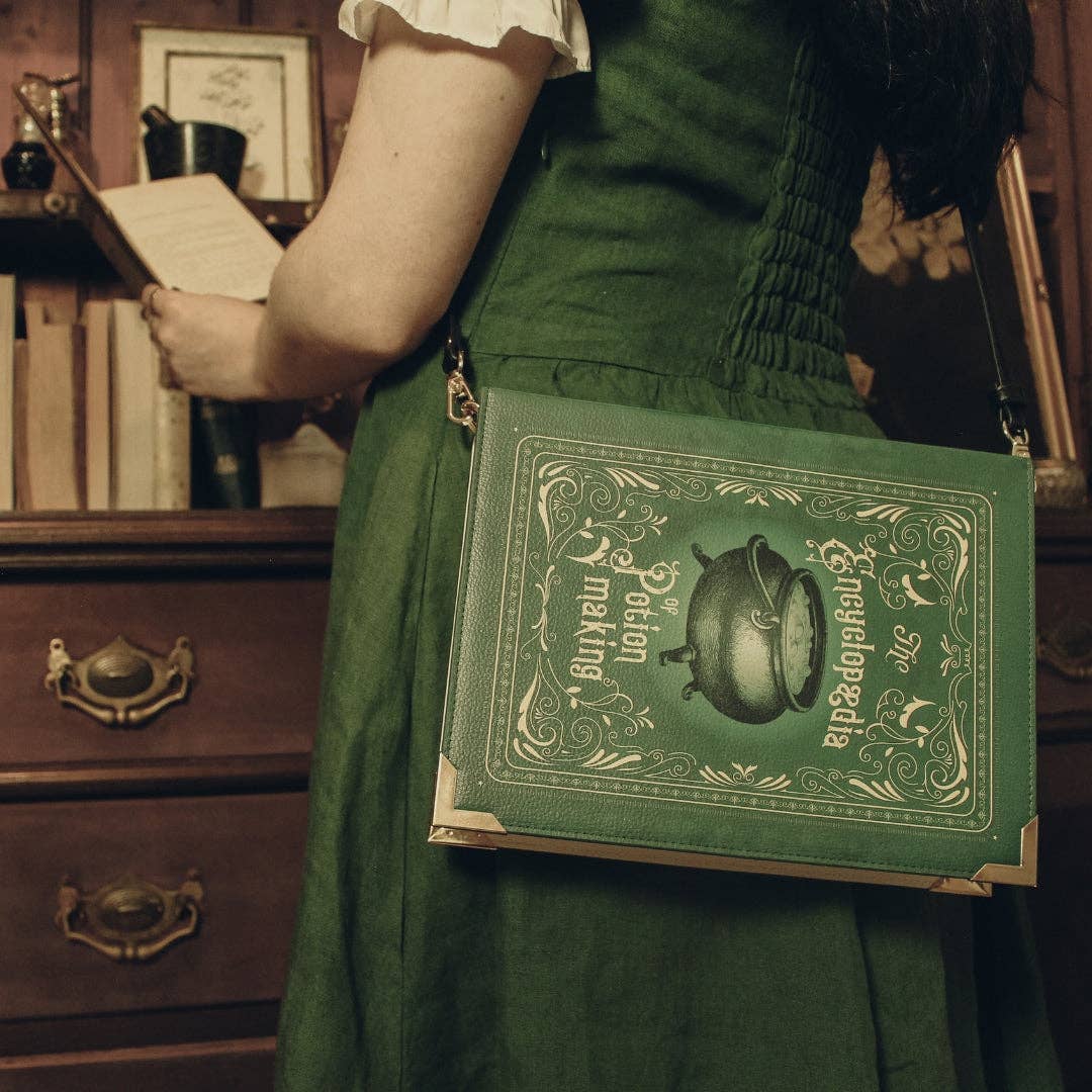 Green book-shaped bag with 'Encyclopedia of Potion Making' design on a white background