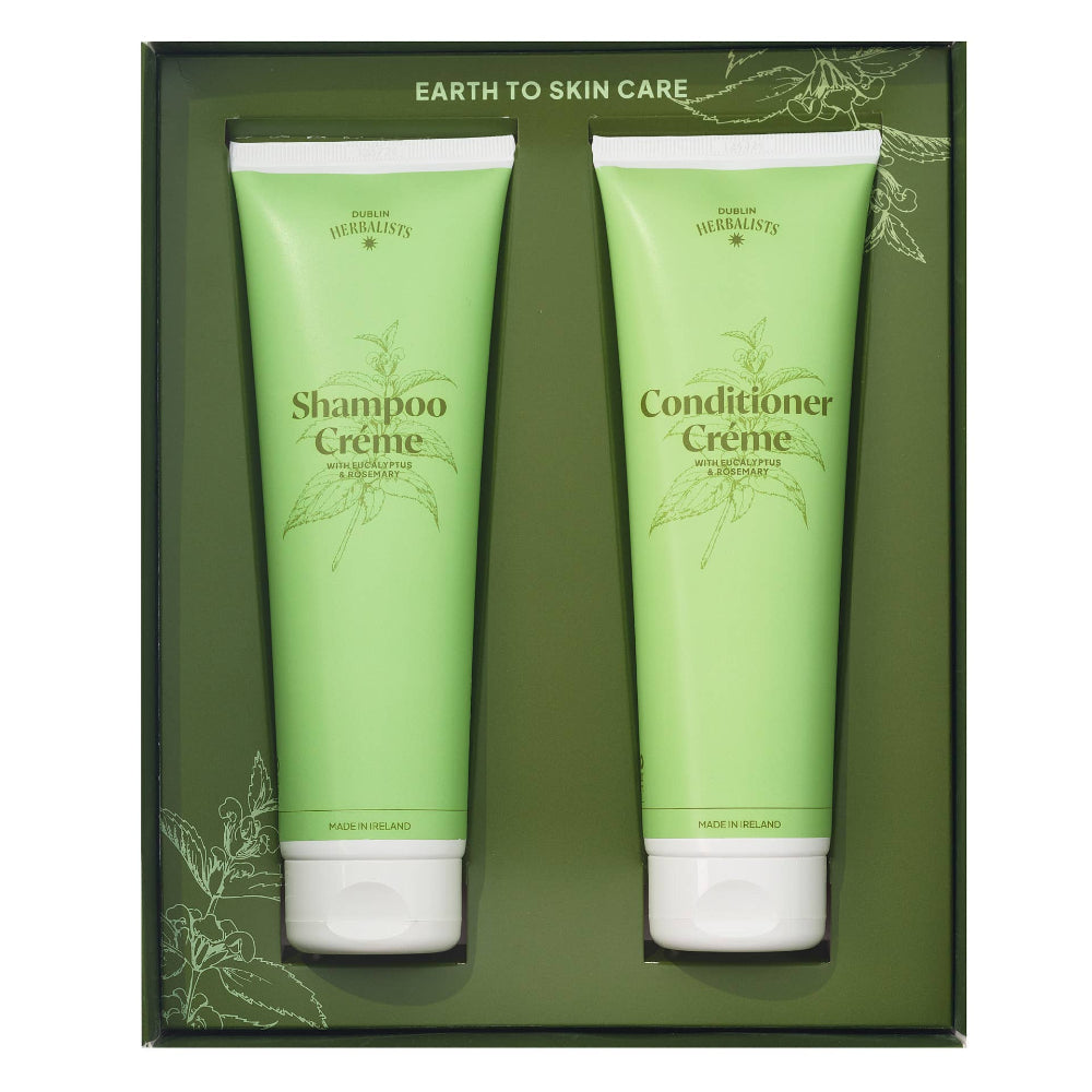 Two green tubes labeled 'Shampoo Crème' and 'Conditioner Crème' in a box with 'Earth to Skin Care' branding.