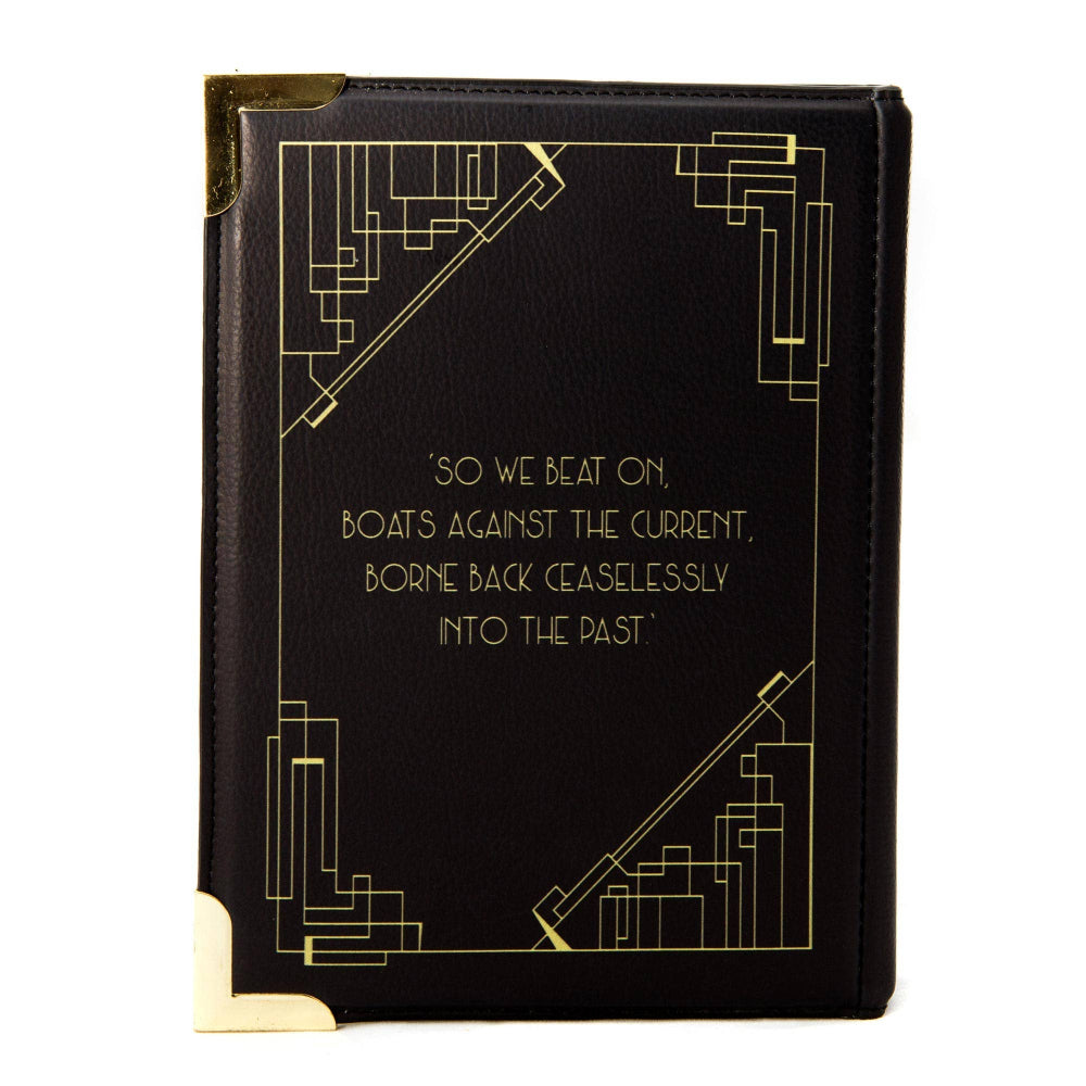 Black book with gold text and decorative elements on a white background