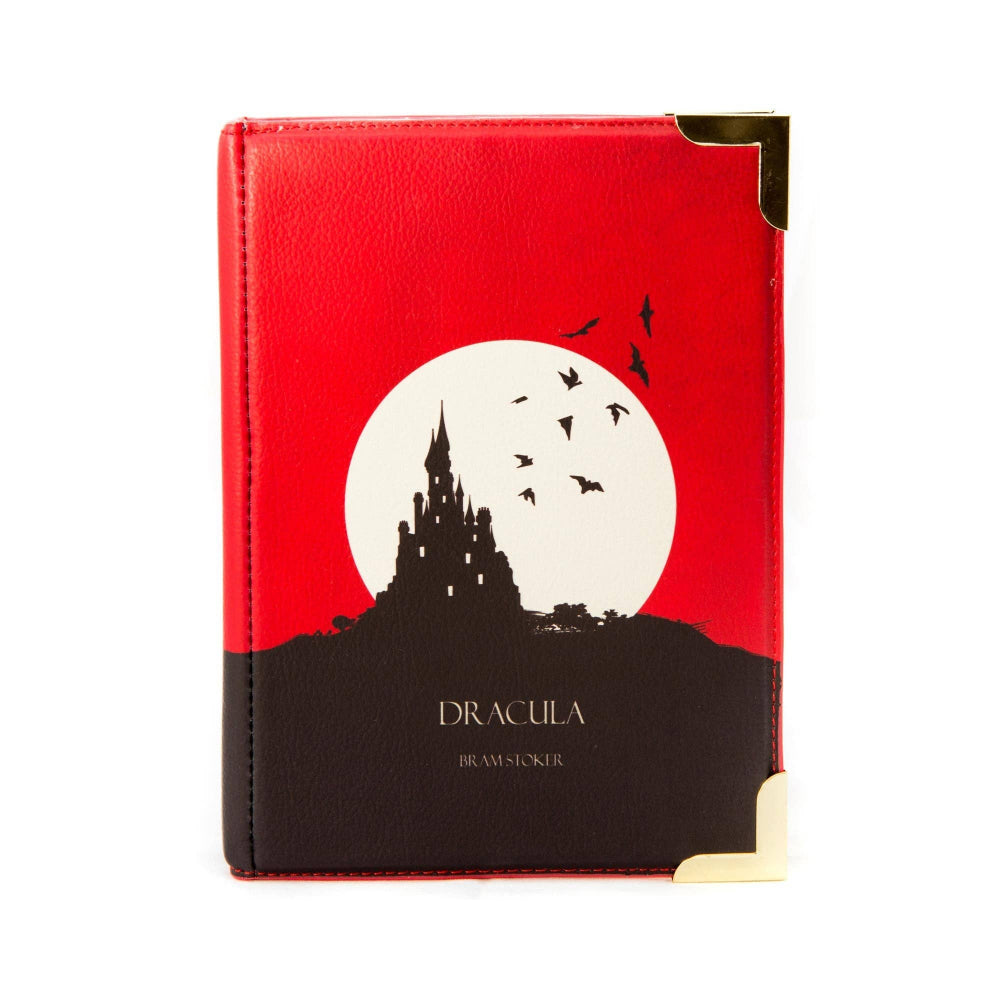 Book cover with a red background, white moon, black castle, and 'Dracula' text.
