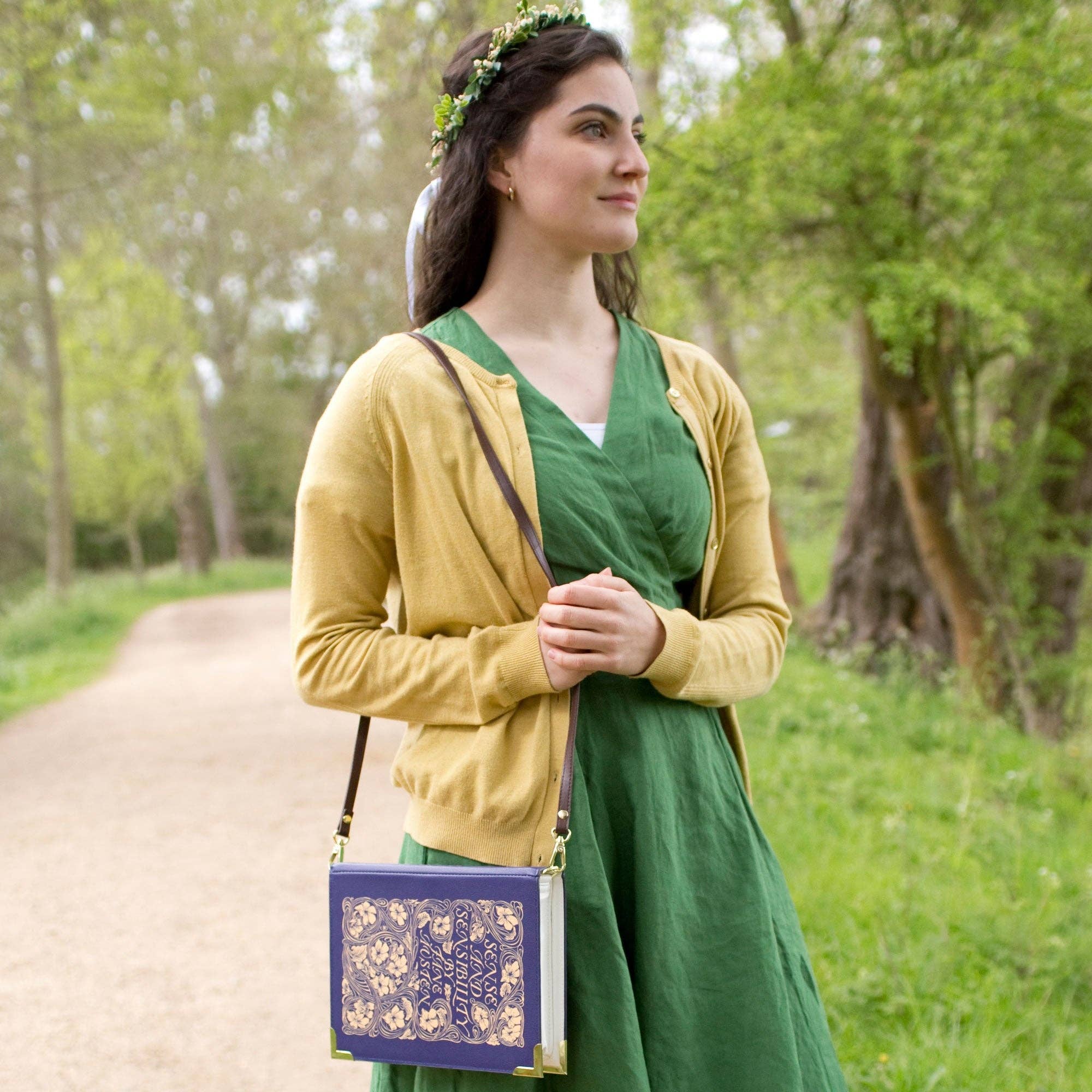 Book-shaped handbag with 'Sense and Sensibility' design on model