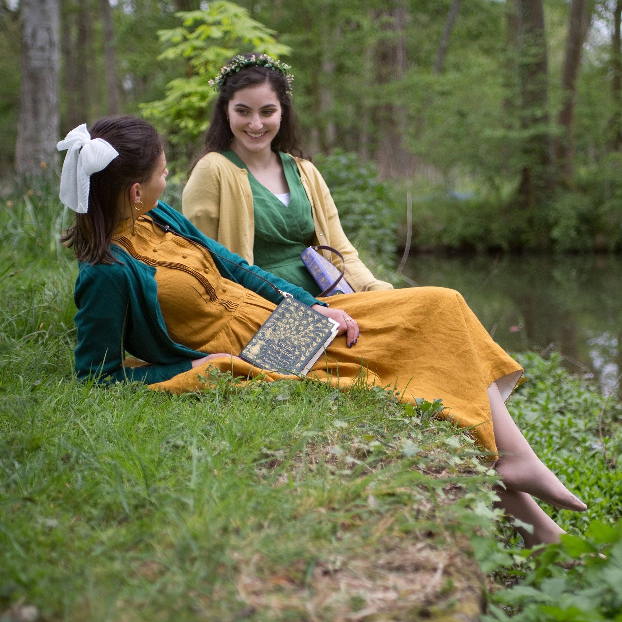 Book-shaped handbag with 'Pride and Prejudice' design on models