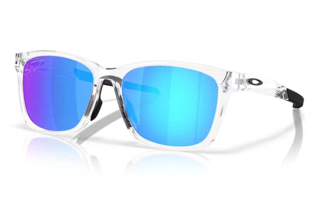 Oakley sunglasses with a clear transparent frame and vibrant blue mirrored lenses
