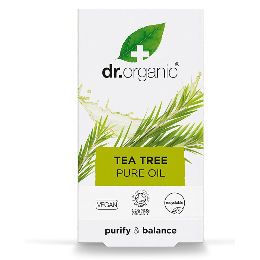 Dr. Organic Tea Tree Pure Oil packaging with green leaves and branding on a white background