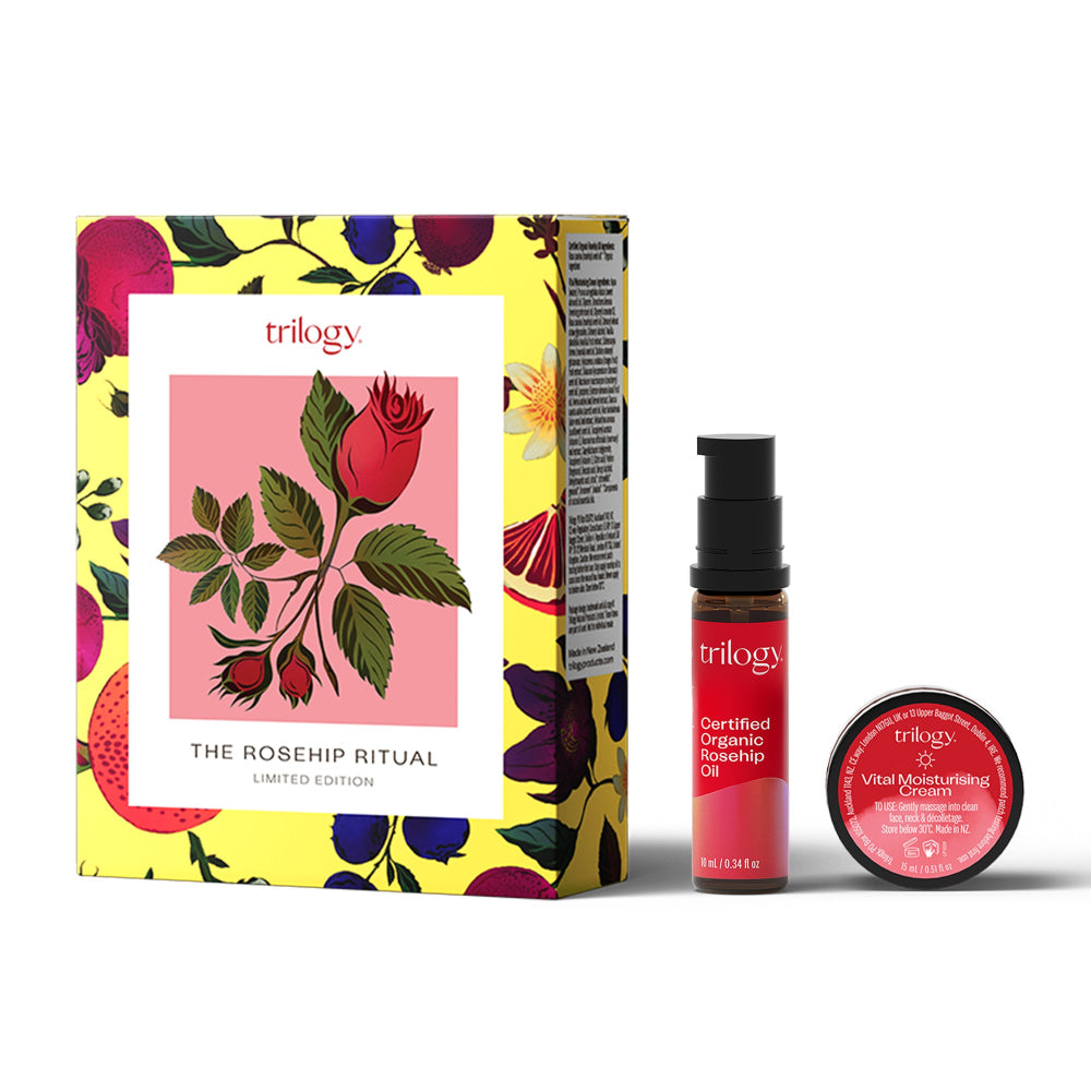 Trilogy skincare products with a colorful box featuring rosehip design on a white background