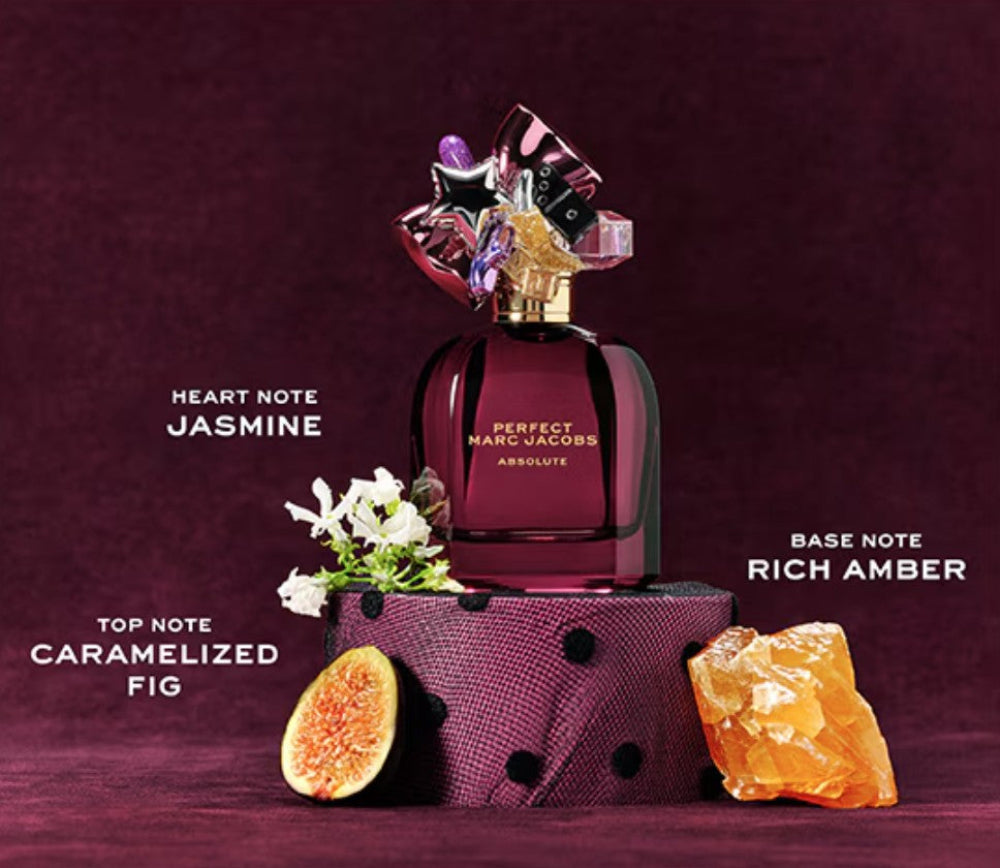 Marc Jacobs perfume bottle with floral and fruit elements on a purple background