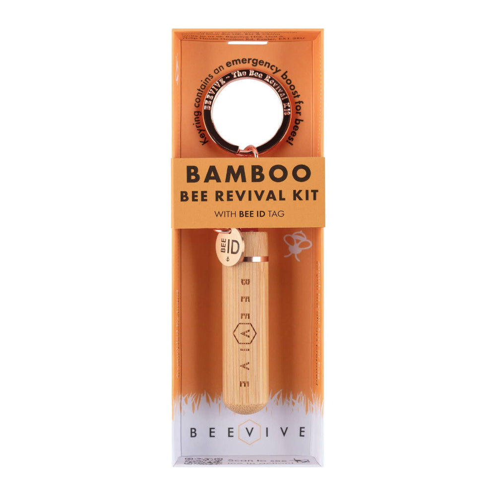Bamboo Bee Revival Kit packaging with a wooden tool and bee ID tag on an orange background.