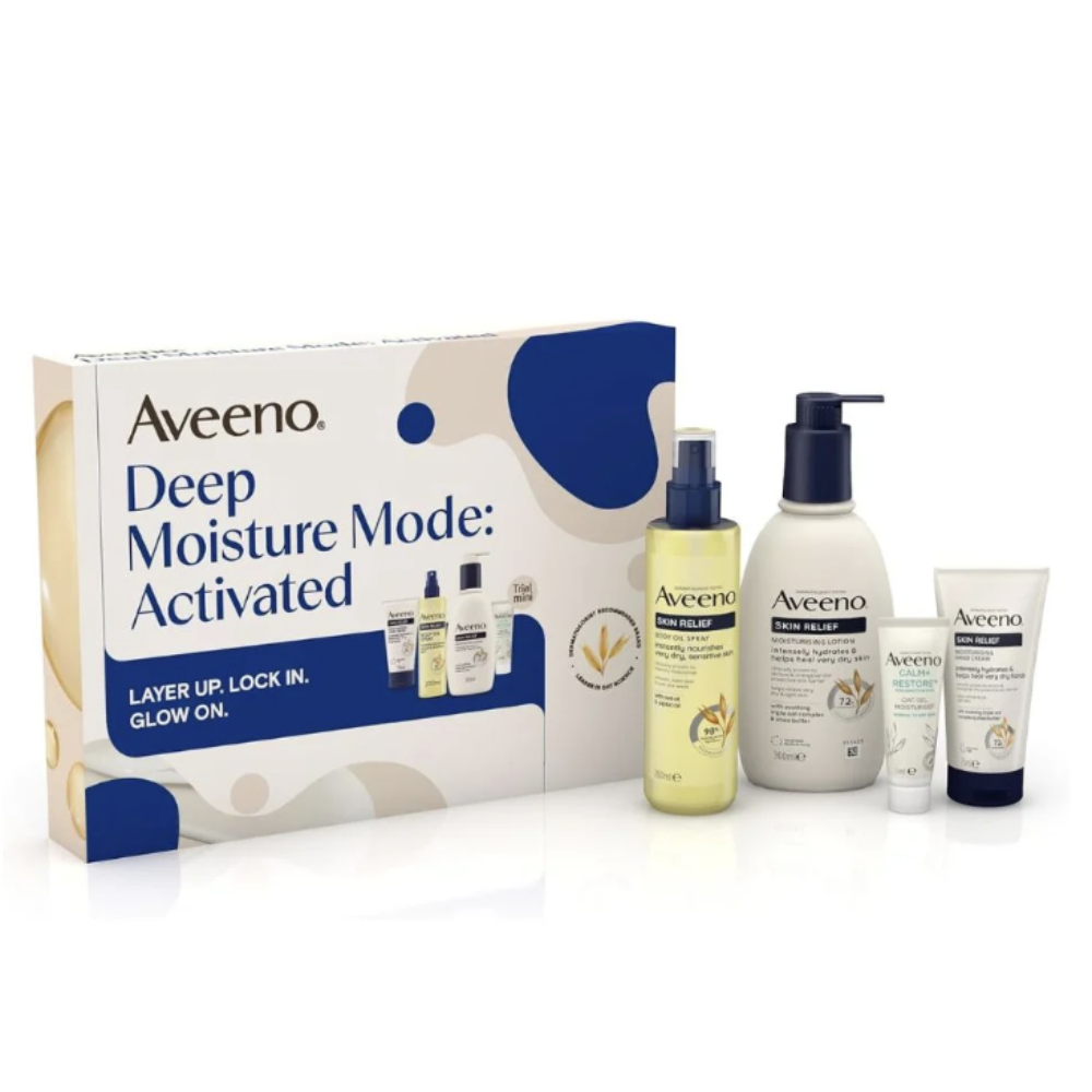 Aveeno Deep Moisture Mode: Activated skincare set including a box, a yellow-toned pump bottle, a large white lotion bottle, a small tube, and a small jar, photographed on a clean white background.