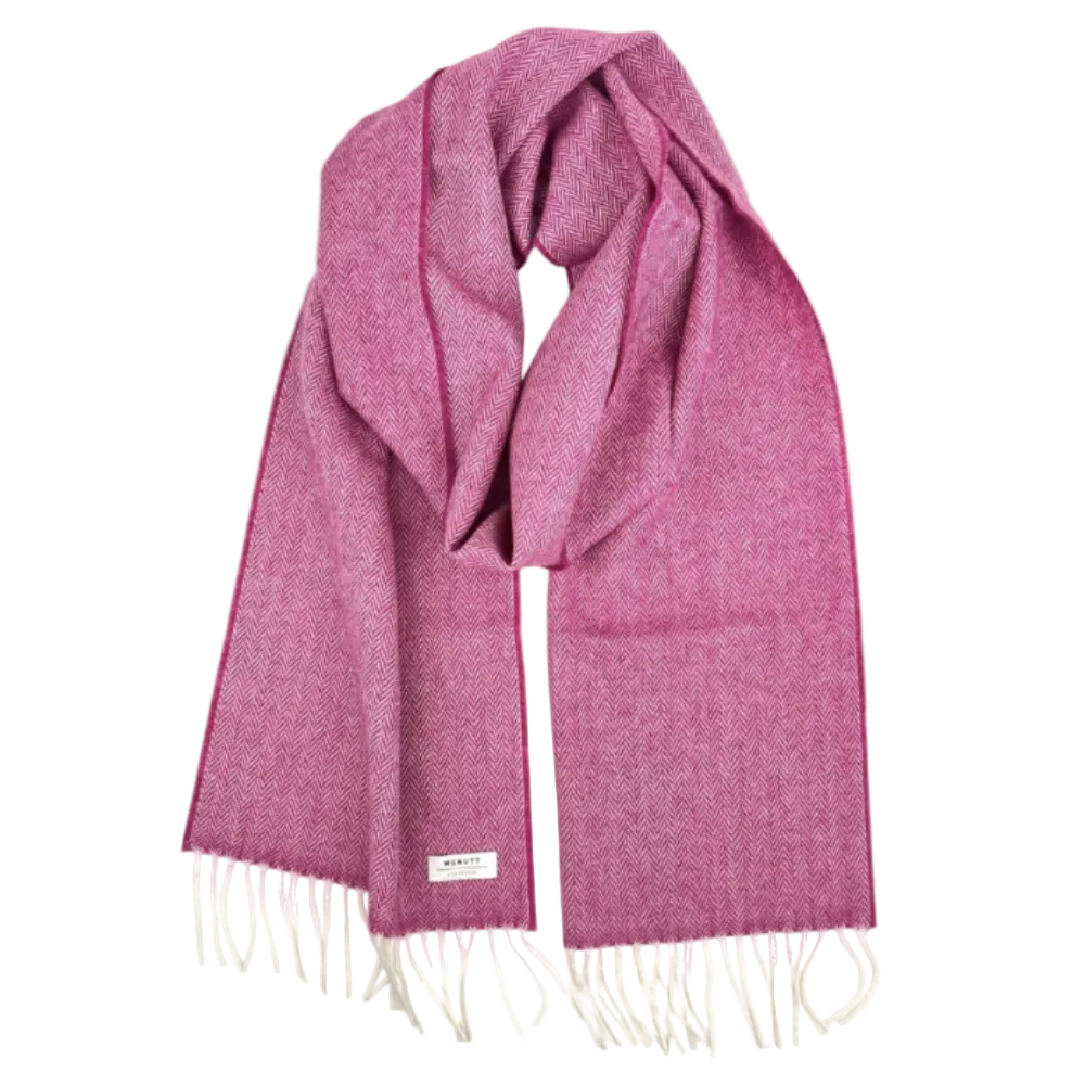 A pink and magenta herringbone pattern wool scarf with cream fringe, displayed on a clean white background.