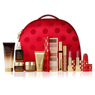 Estée Lauder beauty set with red polka dot bag on a white background