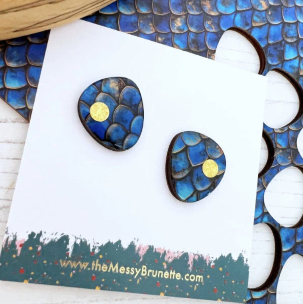 Blue and gold earrings on a card with 'the Messy Brunette' branding.