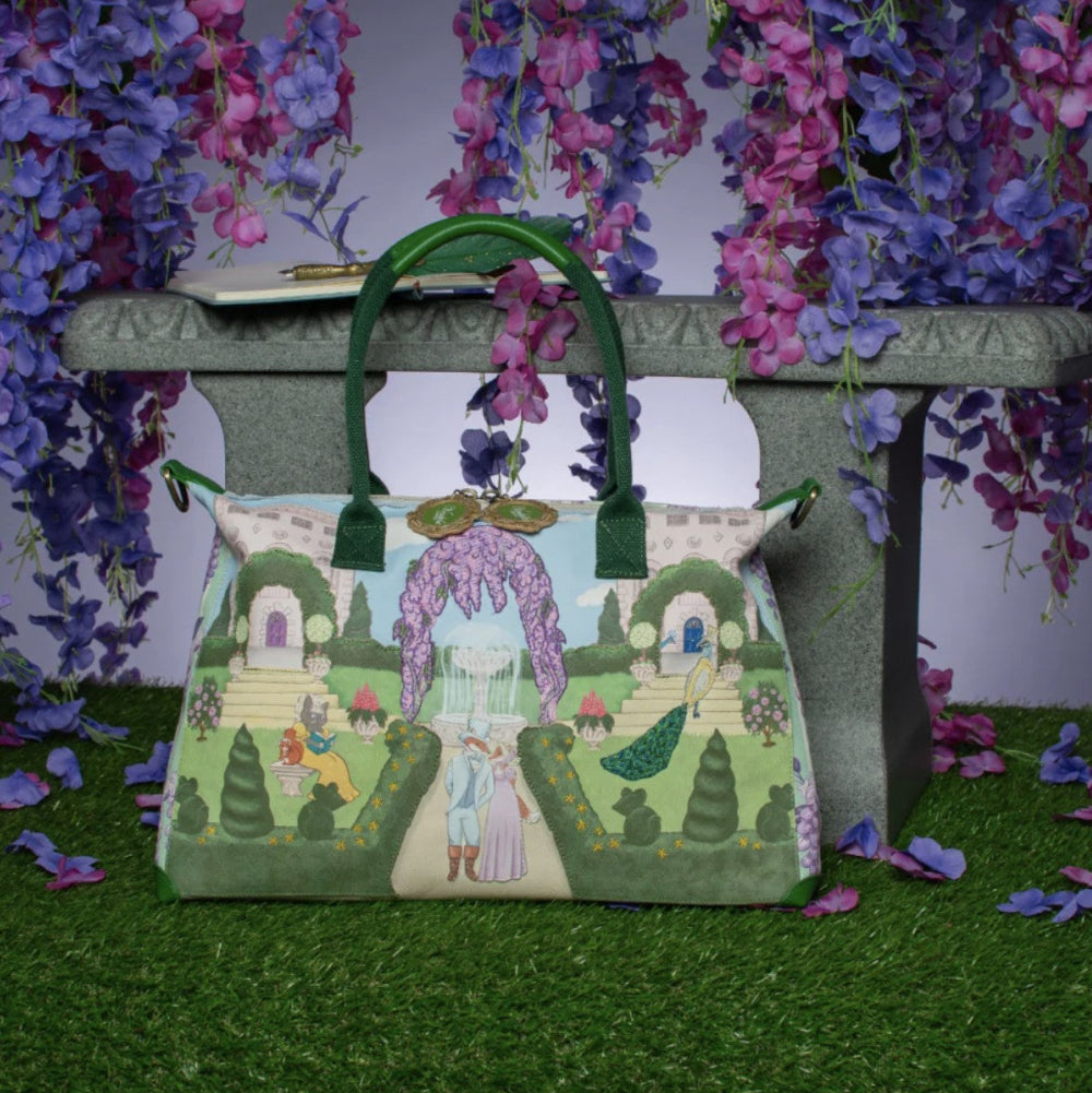 Decorative bag with garden scene design on a stand with floral background
