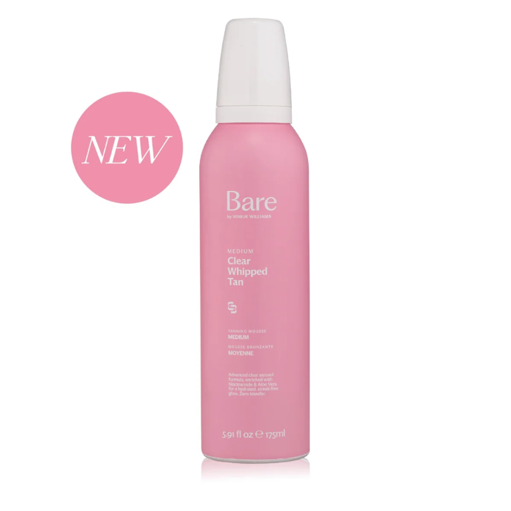 A pink aerosol can of Bare by Vogue Clear Whipped Tan with a white cap, shown on a white background with a pink circular 'NEW' badge on the left.