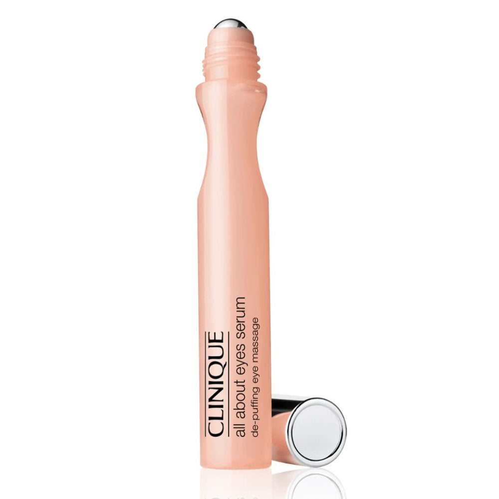 Clinique All About Eyes Serum De-Puffing Eye Massage Roll-On in a pink tube with a metallic cap.