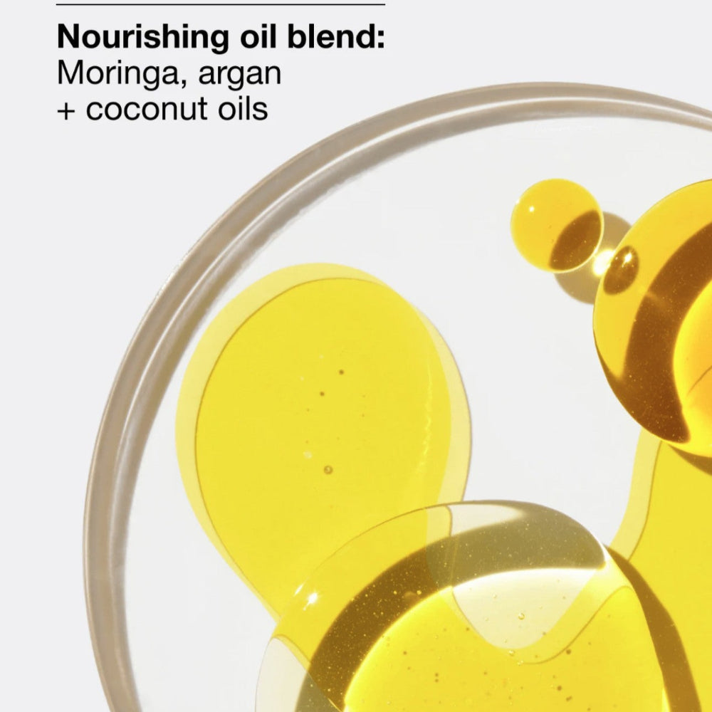 Nourishing oil blend with Moringa, argan, and coconut oils in a glass container.