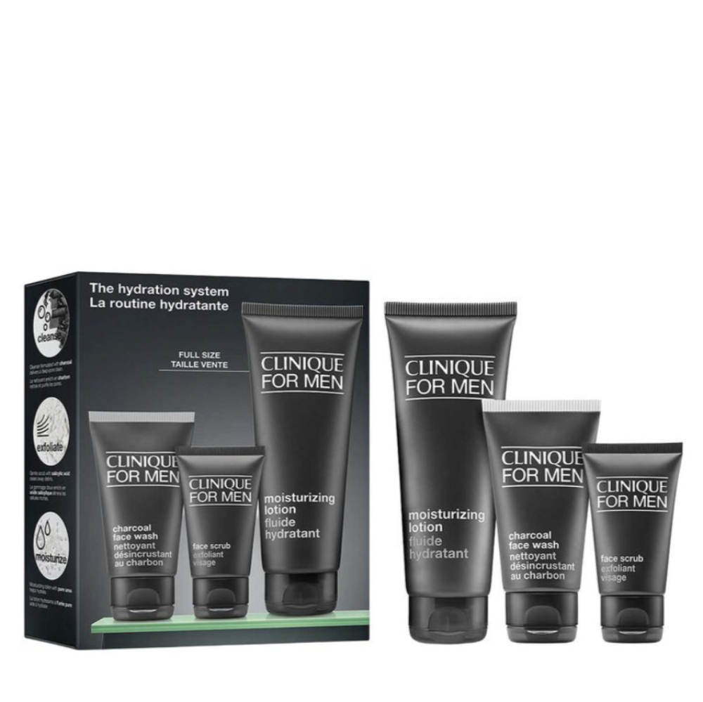 Clinique For Men hydration system set, featuring a black gift box and three black skincare tubes (charcoal face wash, moisturizing lotion, and face scrubs) on a white background.