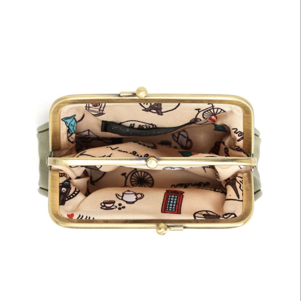 An open kiss-lock coin purse shown from a top-down view, featuring a gold-tone metal frame and a beige printed fabric lining with black illustrations of teapots, cups, and a red telephone booth.