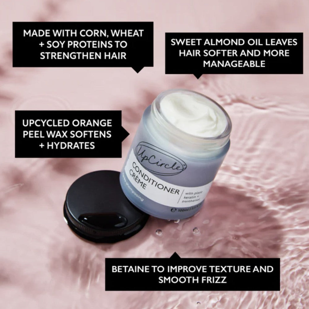 UpCircle conditioner crème jar with text on a pink background