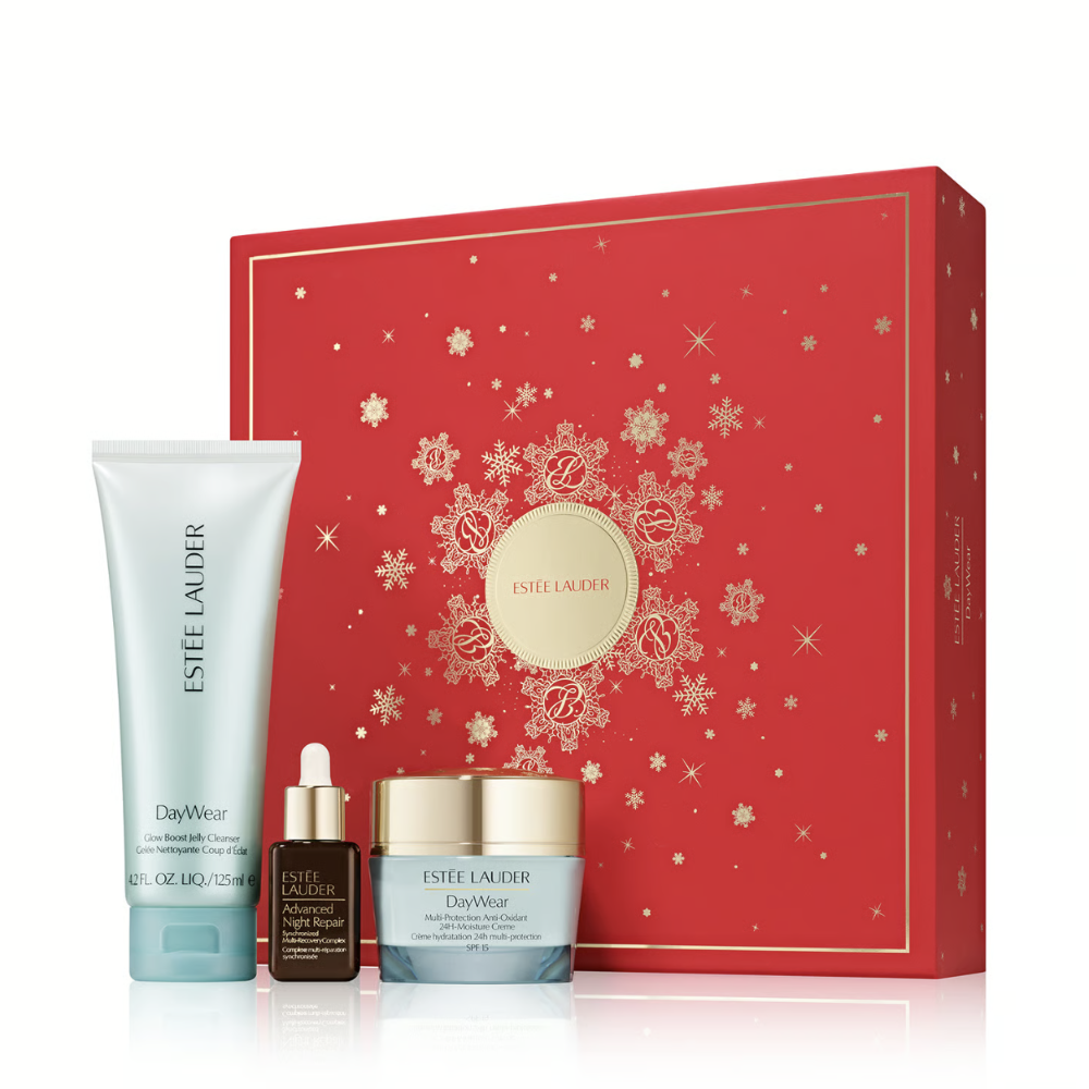 Estée Lauder DayWear holiday gift set featuring a red gift box with gold snowflake and rose patterns
