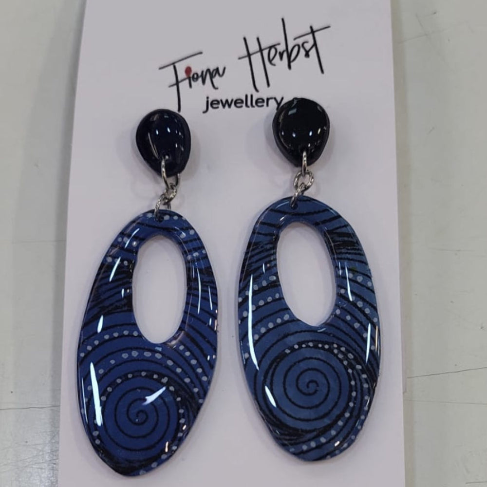 Blue earrings on a Fionn Hobart branded card