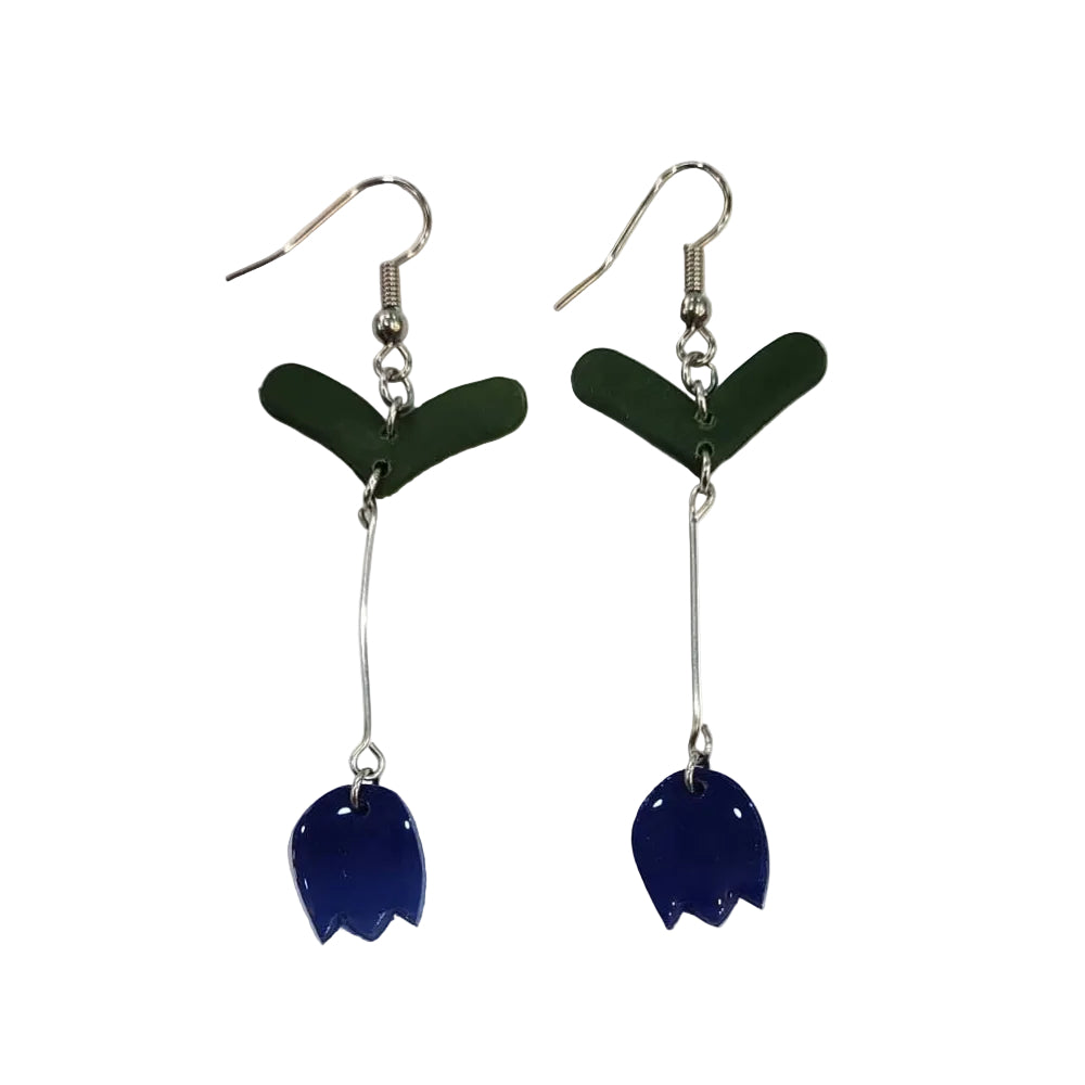 Pair of earrings with green and blue components on a white background