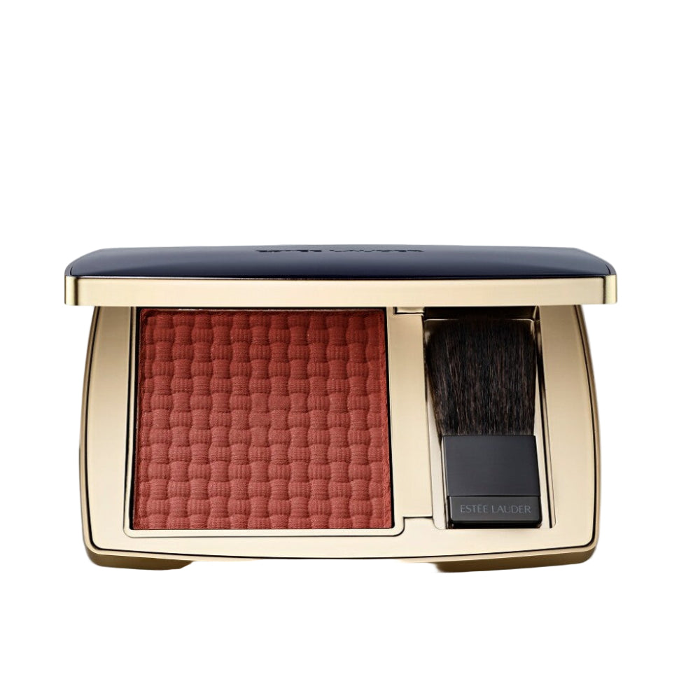 Makeup compact with blush and brush on a light gray background