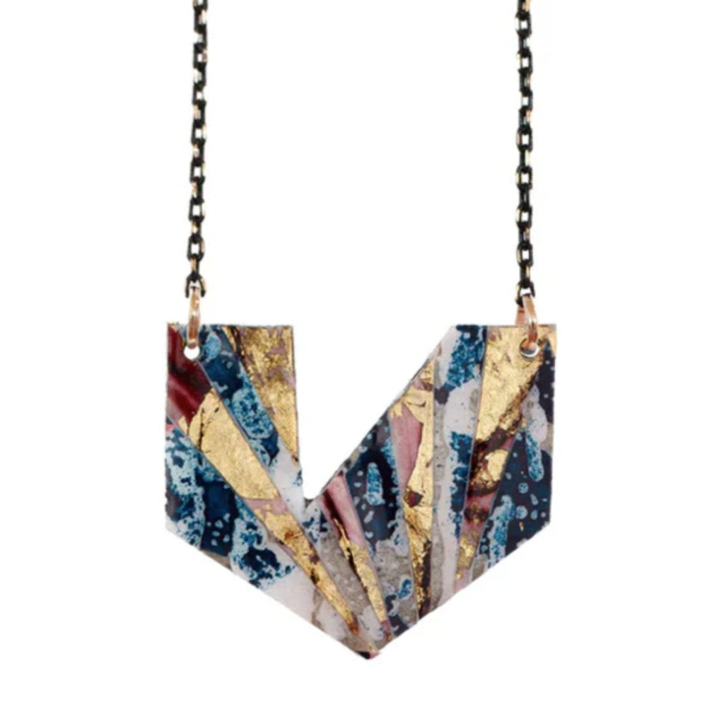 Colorful geometric necklace with a chain on a white background