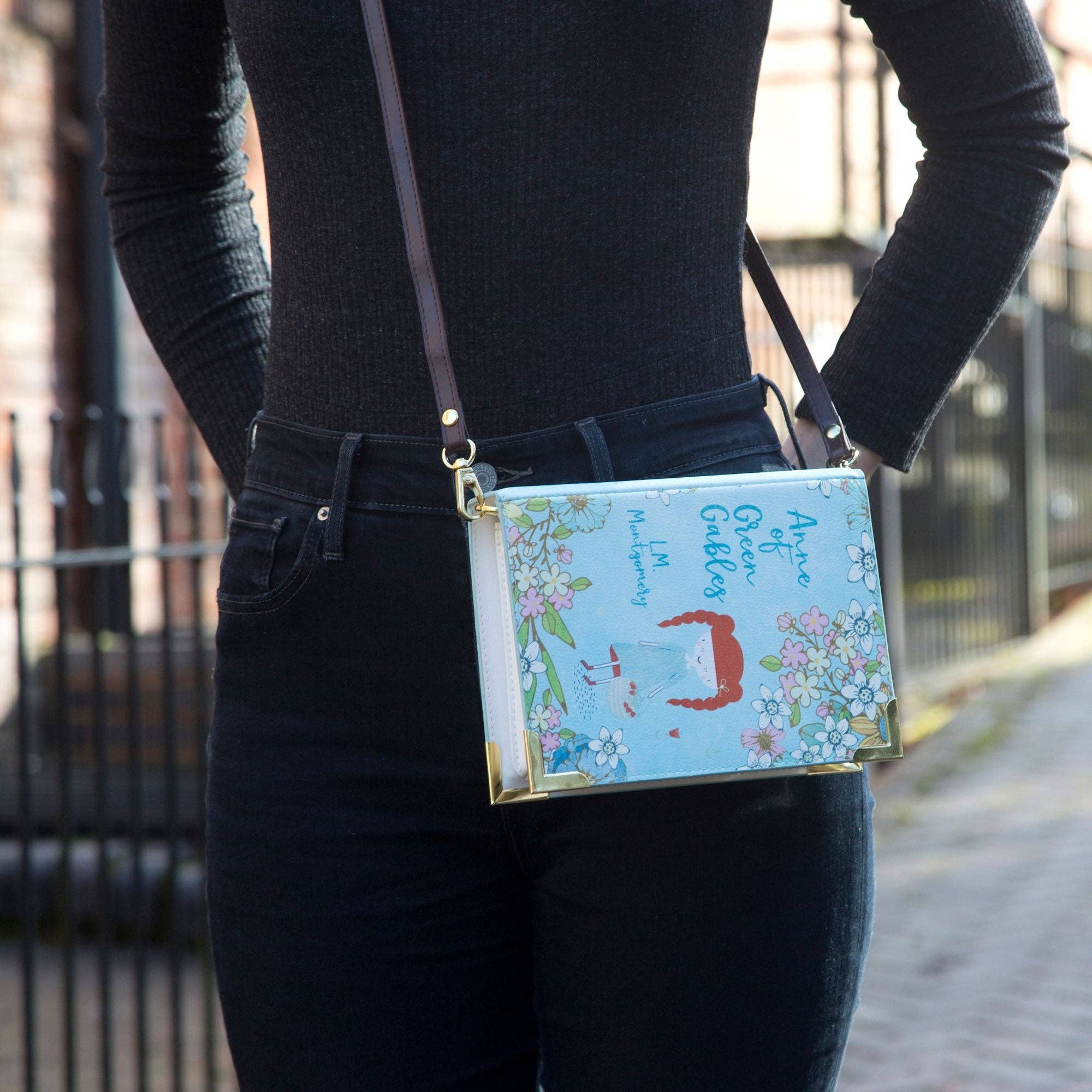 Book-shaped handbag with 'Anne of Green Gables' design on a white background