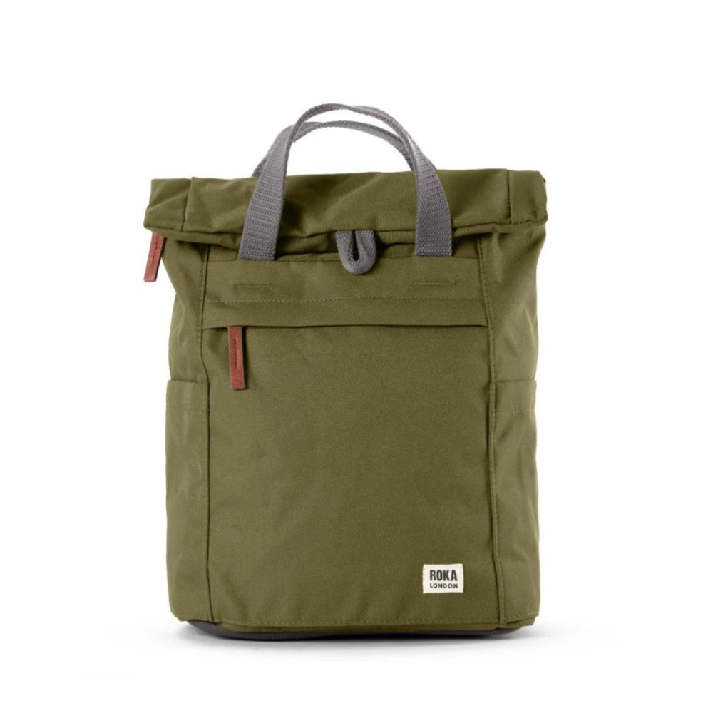 Green backpack with gray handle on a white background