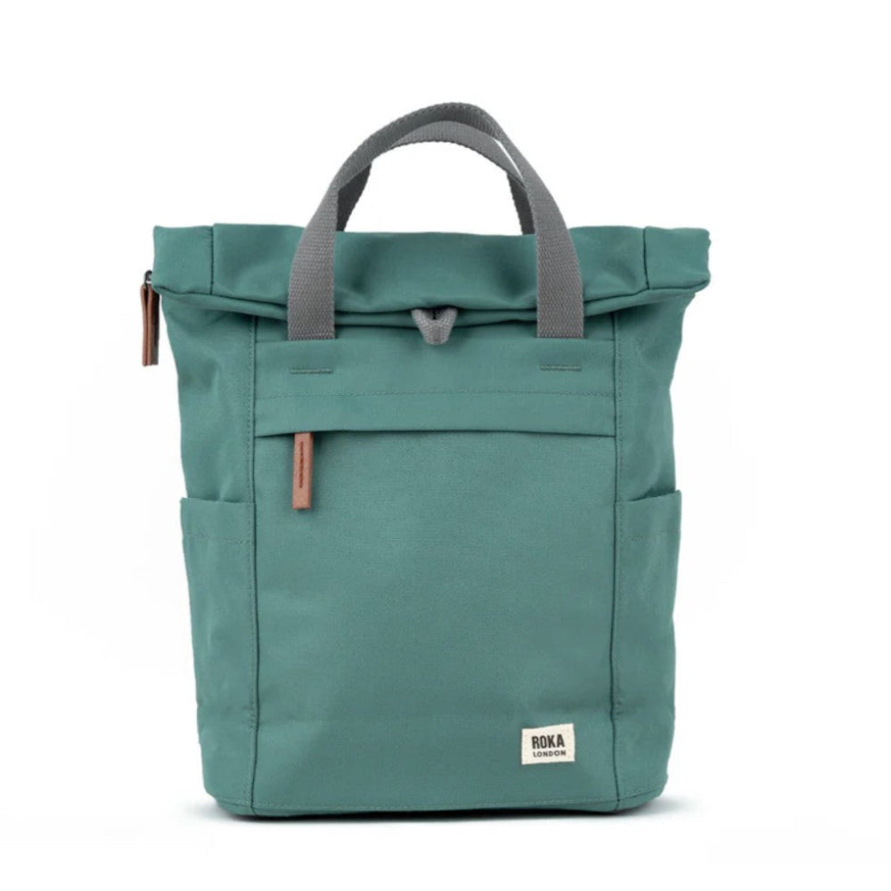 Green backpack with gray handles on a white background