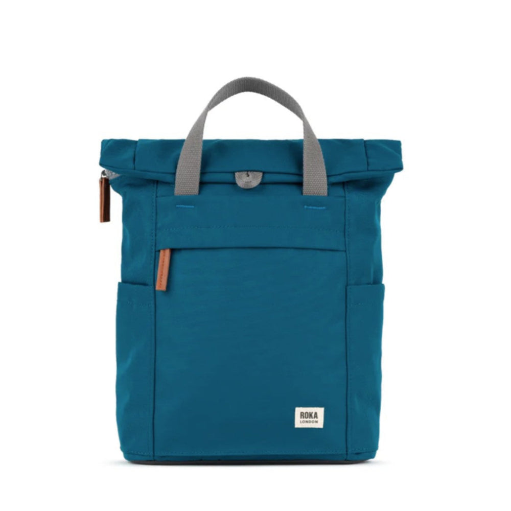 Blue backpack with gray handle on a white background