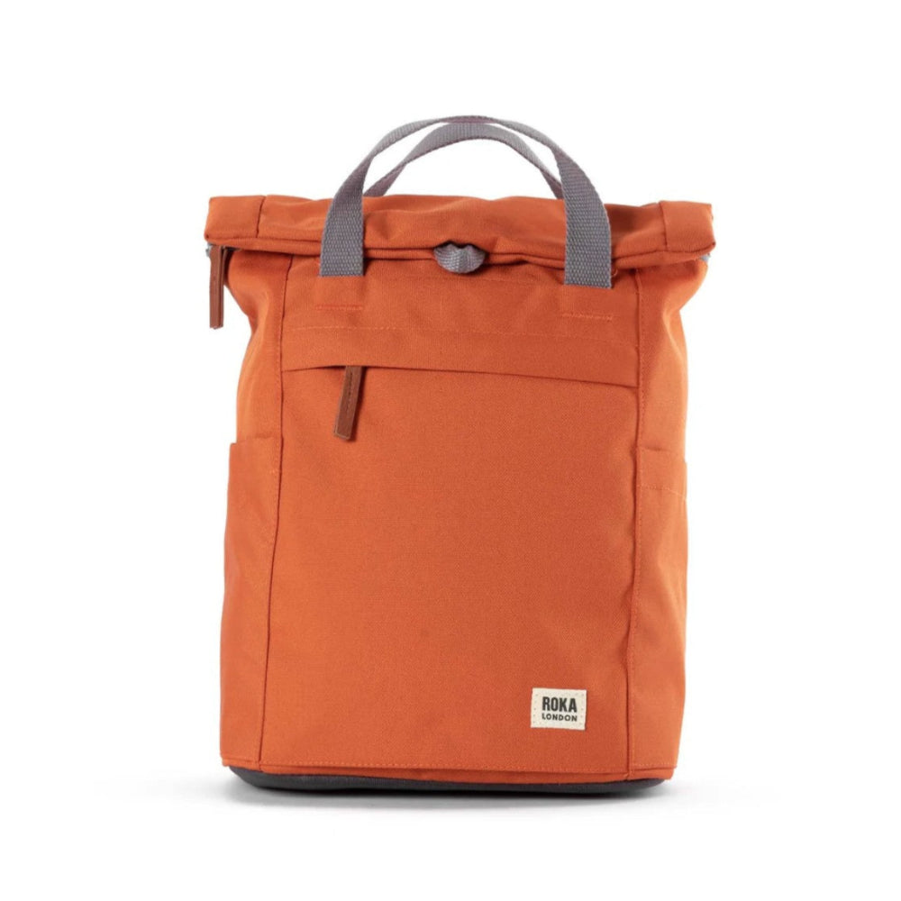 Orange backpack with gray handle on a white background