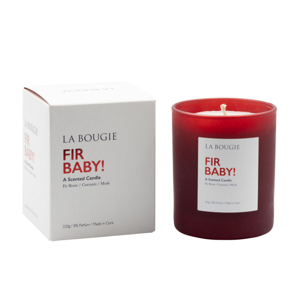 Red candle with 'Fir Baby' label and matching box on a white background