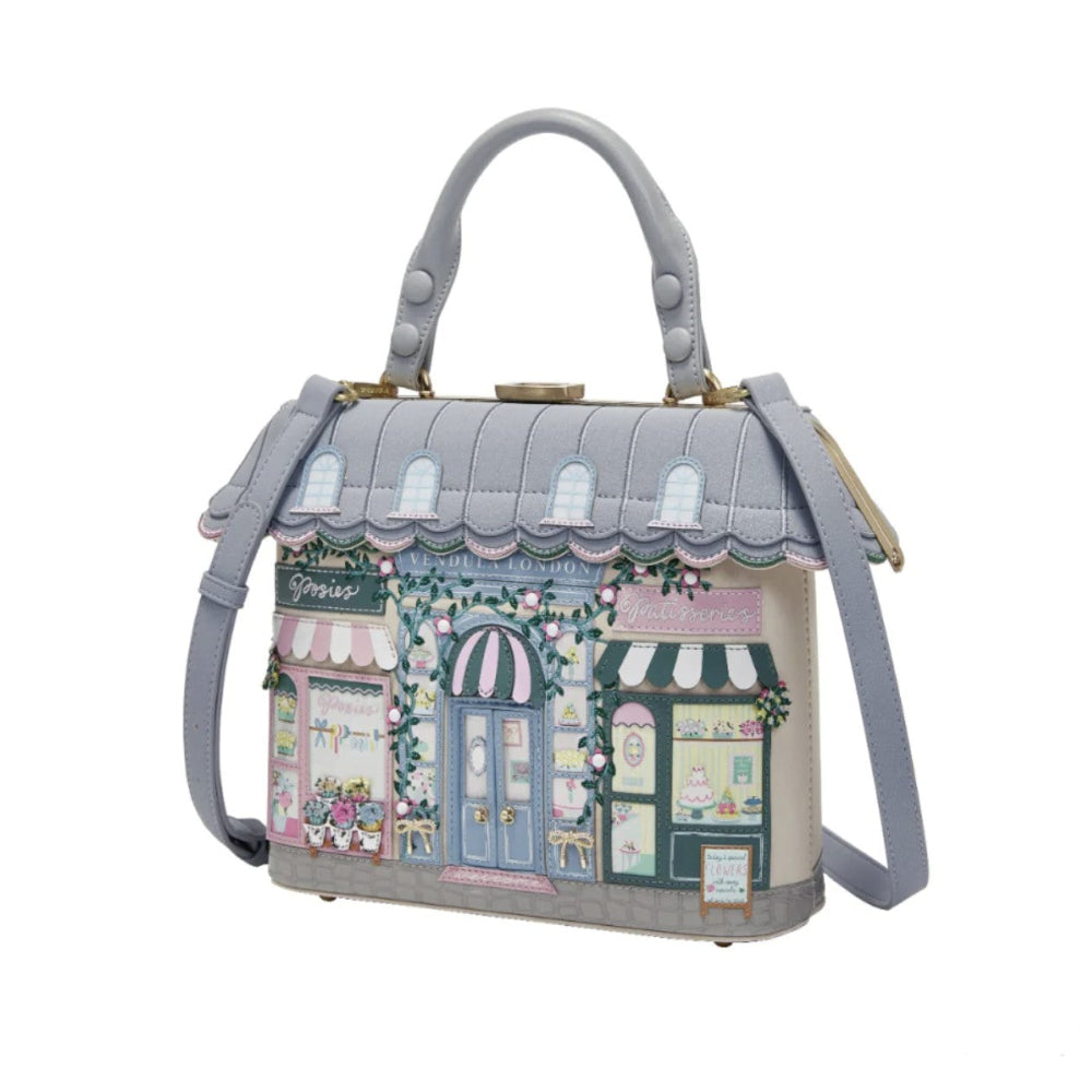 Handbag with a design of a quaint street scene on a white background