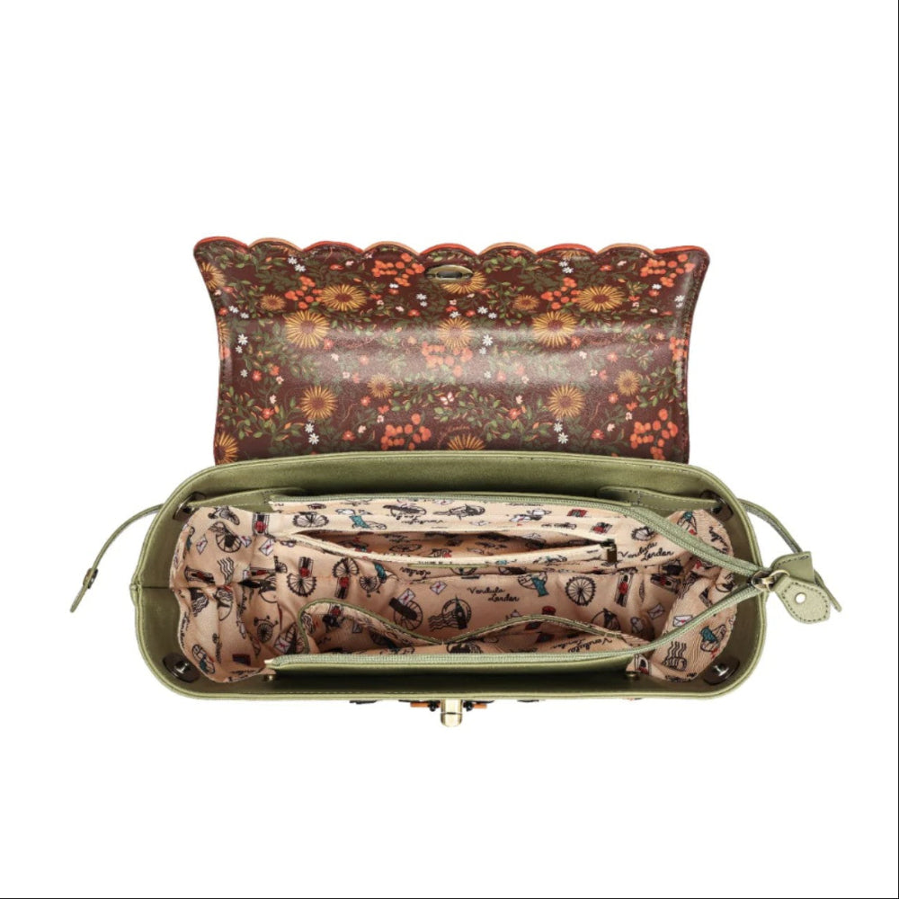 An open olive green handbag with a floral patterned exterior and a beige patterned interior organizer pouch.