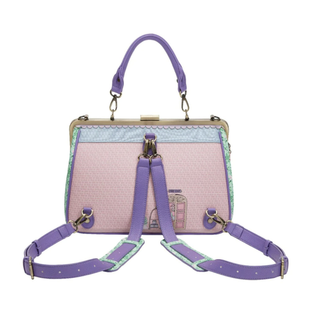 Handbag with purple straps and a light pink body on a white background