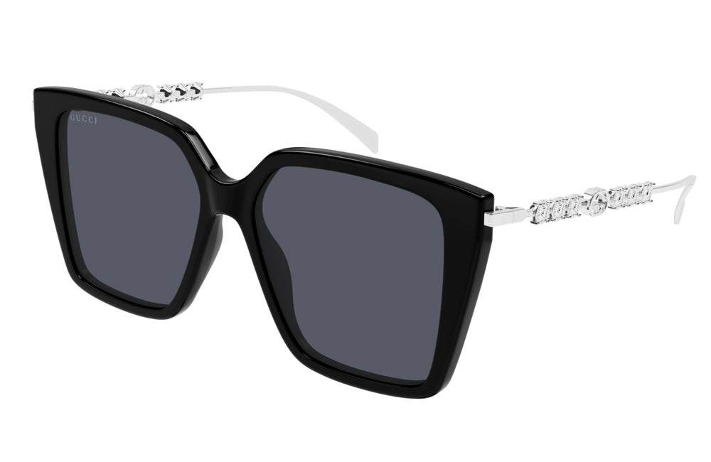 Black sunglasses with silver accents on a white background