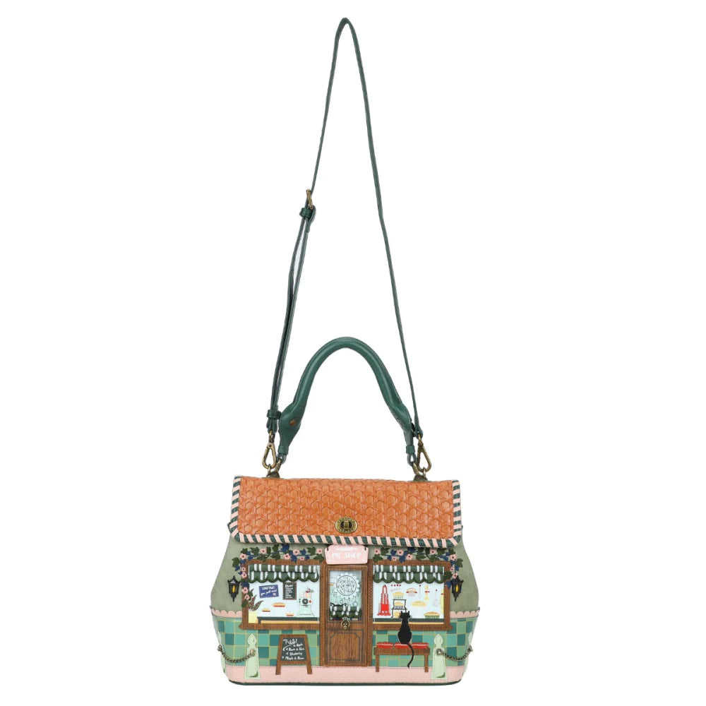 Handbag with a design of a quaint town scene on a white background
