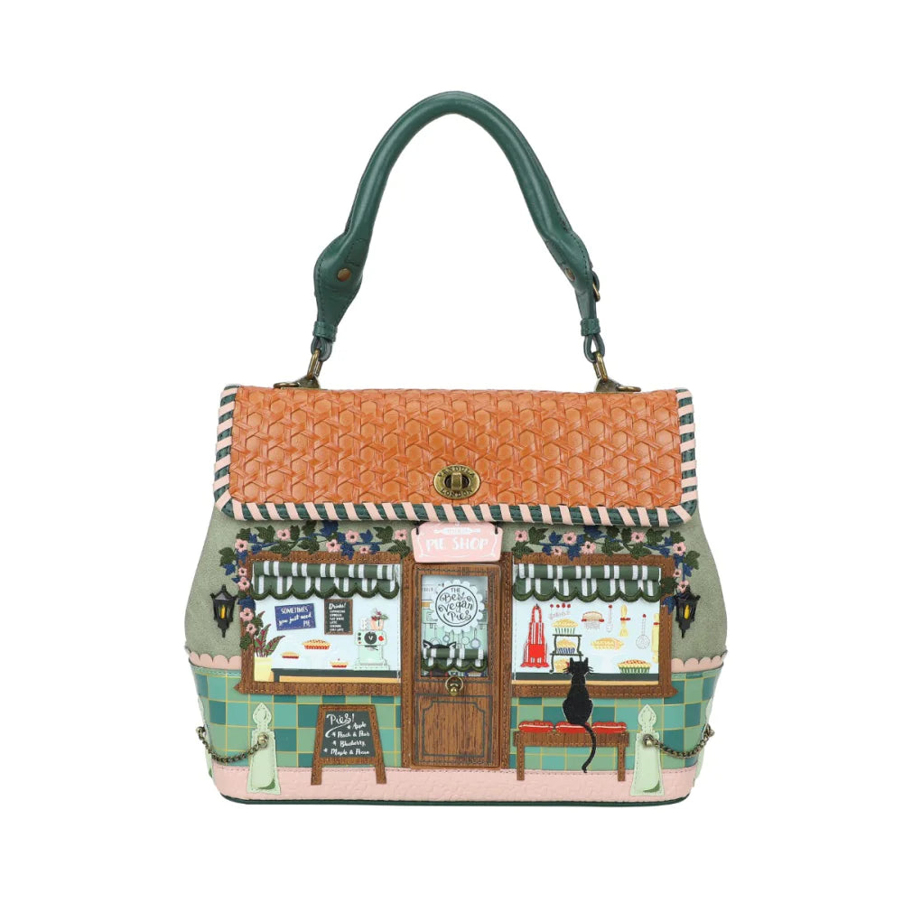 Handbag with a detailed design of a cat cafe on a white background