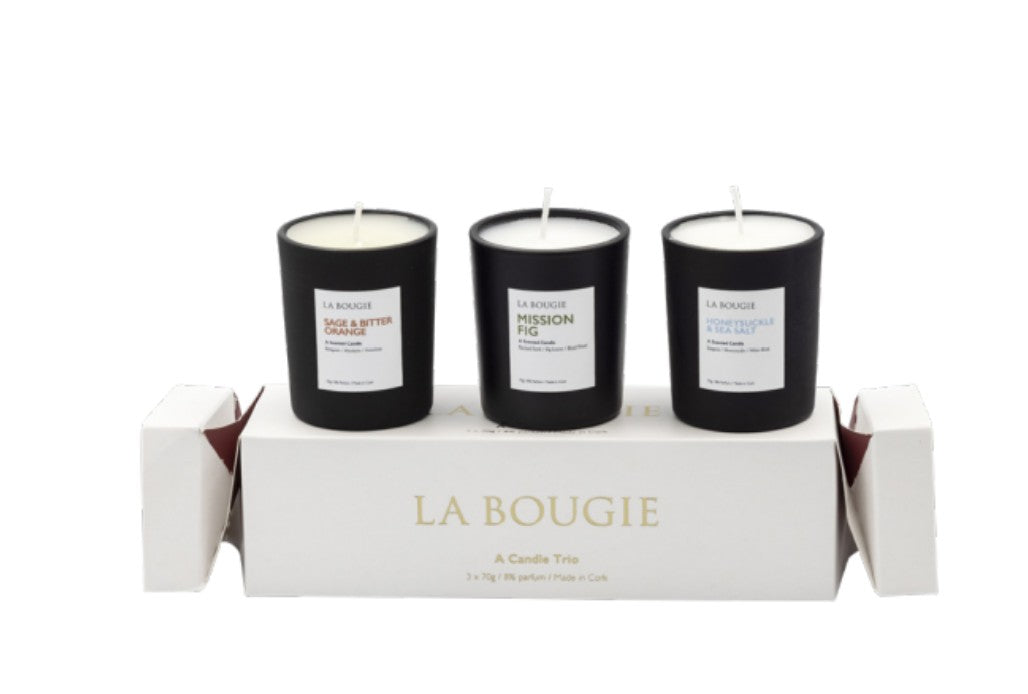 Three black candles in a box with 'La Bougie' branding on a white background