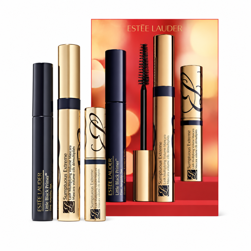 Estée Lauder makeup set featuring three cosmetic tubes and a matching red gift box on a light gray background. The set includes Little Black Primer in black packaging, Sumptuous Extreme in gold packaging