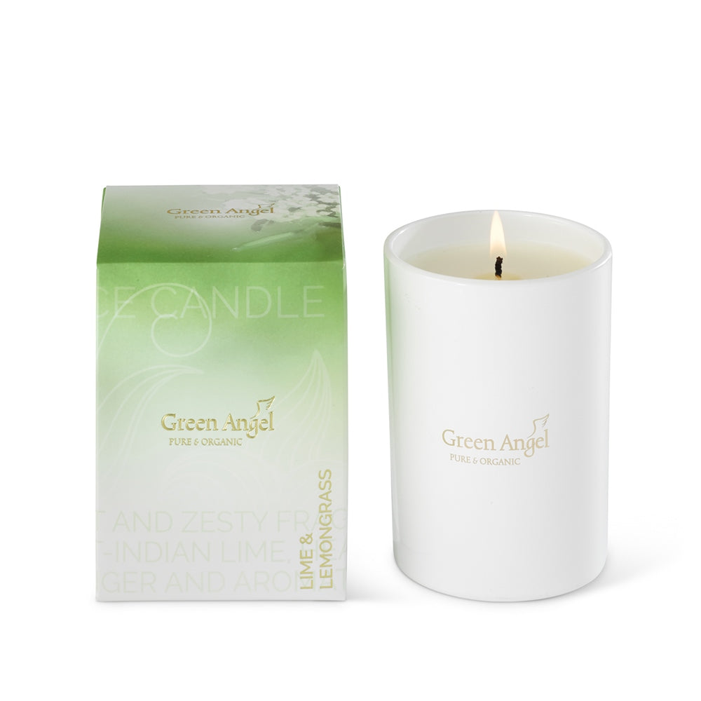 White candle with 'Green Angel' branding next to its packaging on a white background