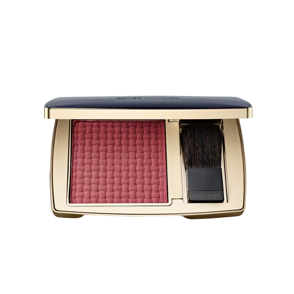 Makeup compact with pink blush and brush on a light gray background