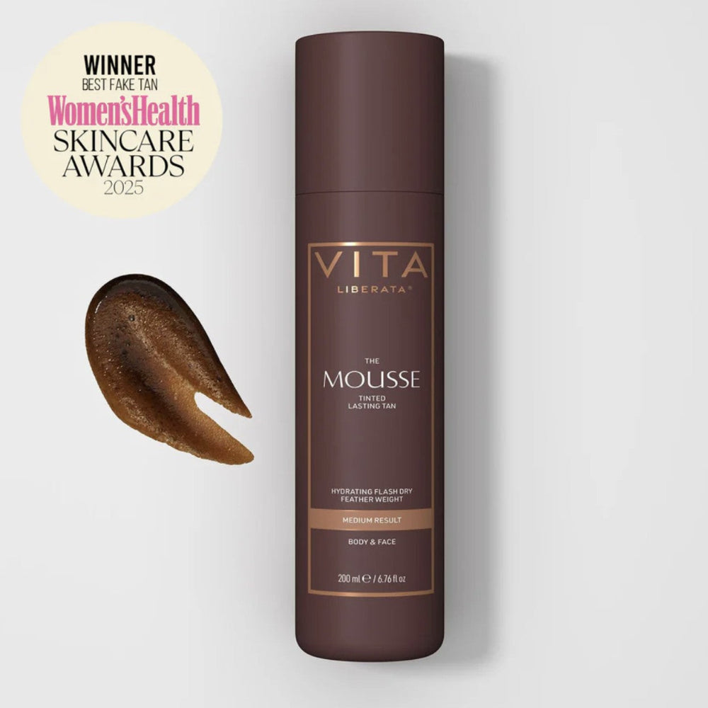 Vita Liberata mousse bottle with brown mousse sample on a light gray background