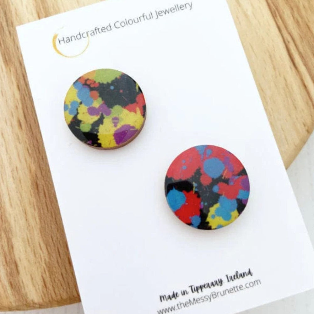 Colorful round earrings on a 'Handcrafted Colourful Jewellery' card with a wooden surface background.