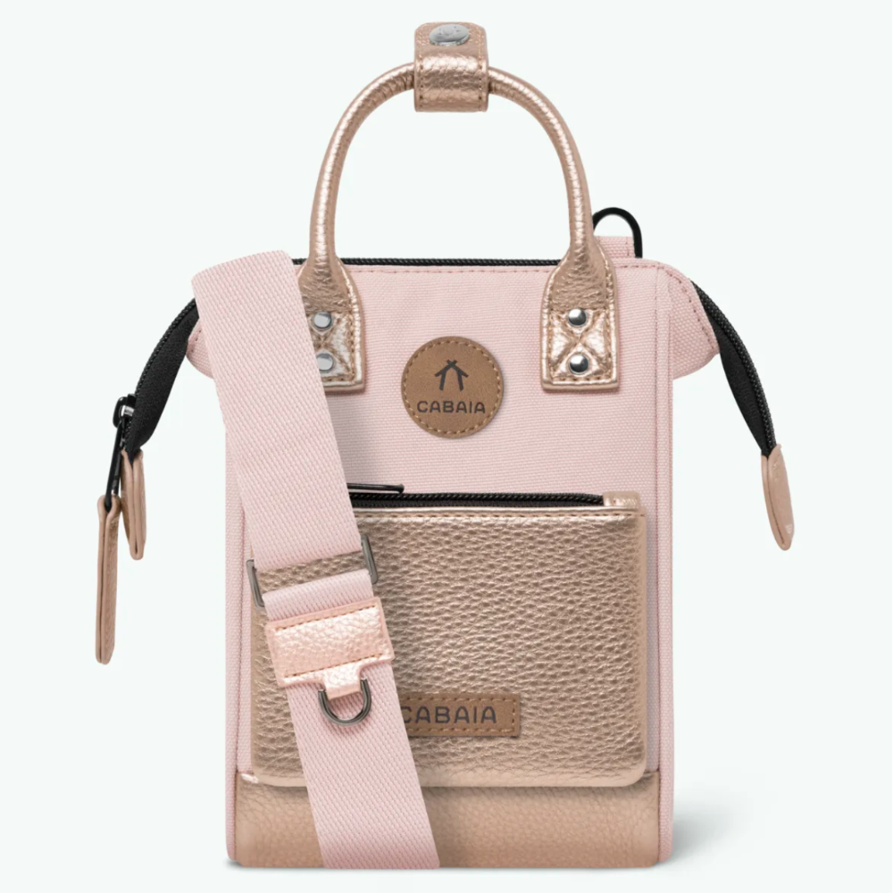 A light pink and beige Cabaia handbag with a matching pink shoulder strap, shown against a plain white background.